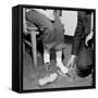 Salesmen Helps Woman with Safety Work Shoes, Ca. 1943-null-Framed Stretched Canvas