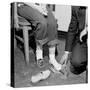 Salesmen Helps Woman with Safety Work Shoes, Ca. 1943-null-Stretched Canvas