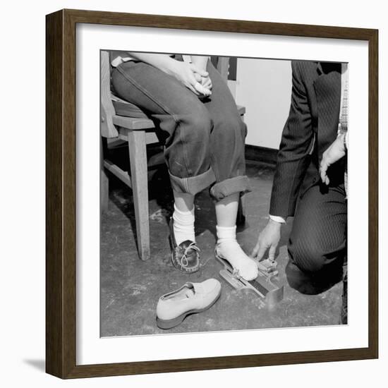 Salesmen Helps Woman with Safety Work Shoes, Ca. 1943-null-Framed Photographic Print