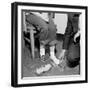 Salesmen Helps Woman with Safety Work Shoes, Ca. 1943-null-Framed Photographic Print