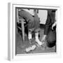 Salesmen Helps Woman with Safety Work Shoes, Ca. 1943-null-Framed Photographic Print