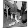 Salesmen Helps Woman with Safety Work Shoes, Ca. 1943-null-Mounted Photographic Print