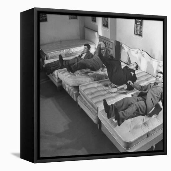 Salesmen Showing How Not to Test a Bed-null-Framed Stretched Canvas