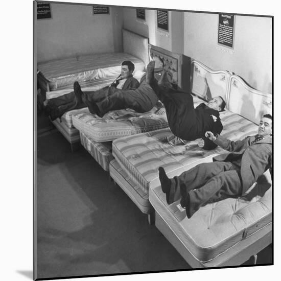 Salesmen Showing How Not to Test a Bed-null-Mounted Photographic Print