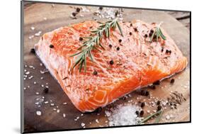 Salmon Filet with Spices on a Wooden Carving Board. Macro Shot.-Volff-Mounted Photographic Print