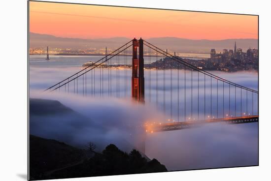 San Francisco At Sunrise, Behind The Golden Gate Bridge And A Low Blanket Of Fog-Joe Azure-Mounted Photographic Print