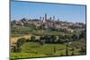 San Gimignano, Siena Province, Tuscany, Italy. Fields surrounding the medieval town famous for i...-null-Mounted Photographic Print