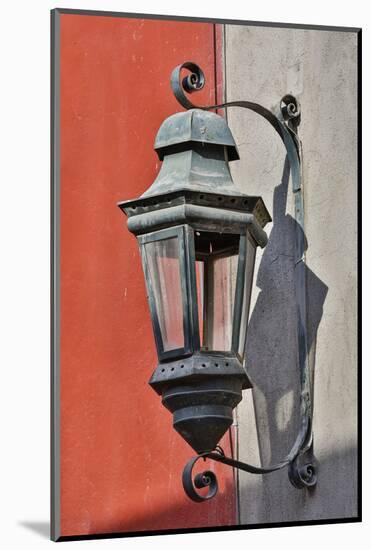 San Miguel De Allende, Mexico. Lantern and shadow on colorful buildings-Darrell Gulin-Mounted Photographic Print