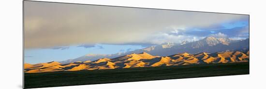 Sand Dunes in a Desert with a Mountain Range in the Background-null-Mounted Photographic Print