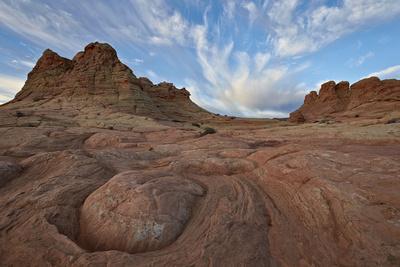 https://imgc.allpostersimages.com/img/posters/sandstone-formations-with-clouds_u-L-PSY1KP0.jpg?artPerspective=n
