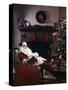 SANTA CLAUS ASLEEP IN CHAIR IN FRONT OF CHRISTMAS TREE AND FIREPLACE INDOOR-Panoramic Images-Stretched Canvas