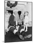 Santa Claus with a Little Boy and a Teddy Bear in Front of a Fire Place-null-Mounted Photo