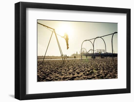 Santa Monica Beach. Silhouette of a Woman Going up with the Swing. Concept about Traveling,United S-Oneinchpunch-Framed Photographic Print