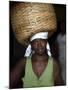 Sao Tomense Woman Carries Basket Full of Cocoa Beans, Cocoa Processing Plant in Agua Ize, Sao Tome-Camilla Watson-Mounted Photographic Print