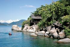 A Snorkeler Explores the Scenic Rock Formations of the Islands of Lake Malawi, Malawi, Africa.-SAPhotog-Laminated Photographic Print