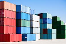 Cargo Shipping Containers Stacked at Harbor Freight Terminal under Clear Blue Sky-Sascha Burkard-Photographic Print