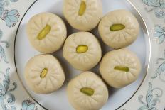 'Peda' an Indian Sweet Made from Condensed Milk. Arranged along with Traditional Lights.-satel-Photographic Print