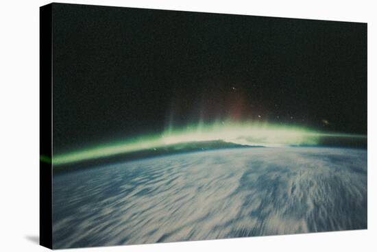 Satellite Image of Northern Lights on the Horizon-Stocktrek-Stretched Canvas