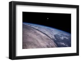 Satellite view of Earth with moon glowing over Saskatchewan, Canada-null-Framed Photographic Print