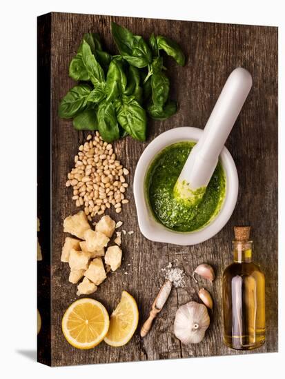 Sauce Pesto and its Ingredients on Rough Wood-Andrii Gorulko-Stretched Canvas