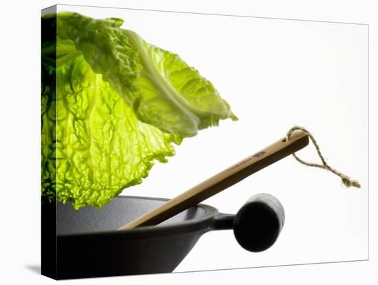 Savoy Cabbage Leaf Falling into a Wok-Jean-Michel Georges-Stretched Canvas