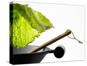 Savoy Cabbage Leaf Falling into a Wok-Jean-Michel Georges-Stretched Canvas