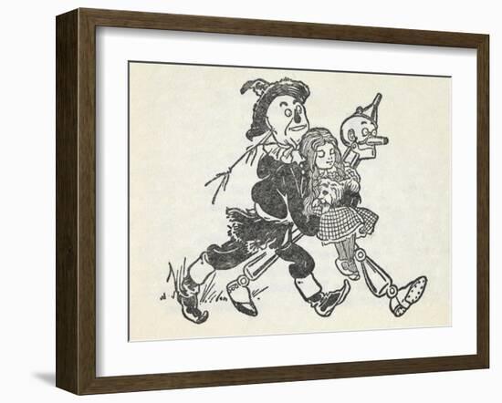 Scarecrow and the Tin Woodman Carrying a Sleeping Dorothy and Toto Out Of the Deadly Poppy Field-William Denslow-Framed Giclee Print