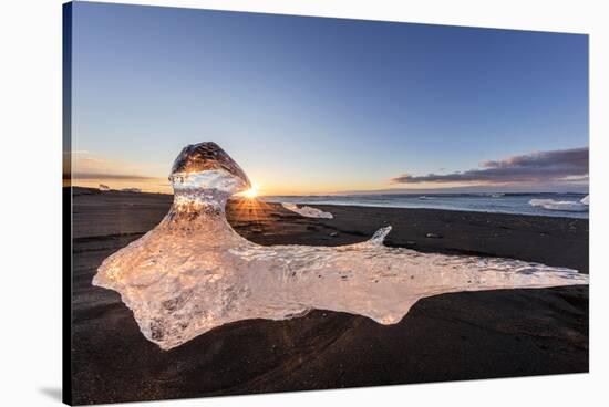 Scattered Ice from Icebergs on Black Sand Beach at Joklusarlon, Iceland-Chuck Haney-Stretched Canvas