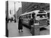 Scene from Seattle During Free Ride Day, with People Boarding a Bus-null-Stretched Canvas