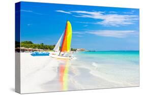 Scene with Sailing Boat at the Famous Varadero Beach , Caribbean Sea in Cuba-Kamira-Stretched Canvas