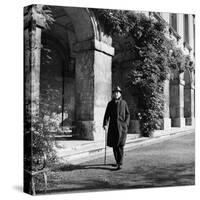 Scholar C.S. Lewis Walking with Cane Near Building at Magdalen College, Oxford University-Hans Wild-Stretched Canvas
