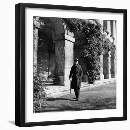 Scholar C.S. Lewis Walking with Cane Near Building at Magdalen College, Oxford University-Hans Wild-Framed Premium Photographic Print