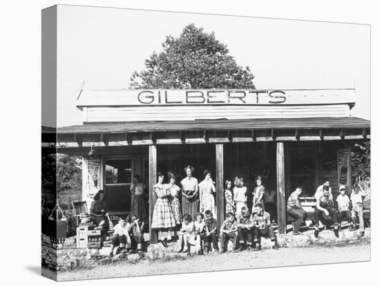 School Children Waiting for the Bus at the General Store-Ralph Crane-Stretched Canvas