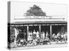 School Children Waiting for the Bus at the General Store-Ralph Crane-Stretched Canvas