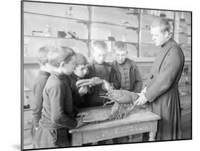 School For Fishing: Monk Shows How to Handle a Lobster, 20th Century-Andrew Pitcairn-knowles-Mounted Giclee Print