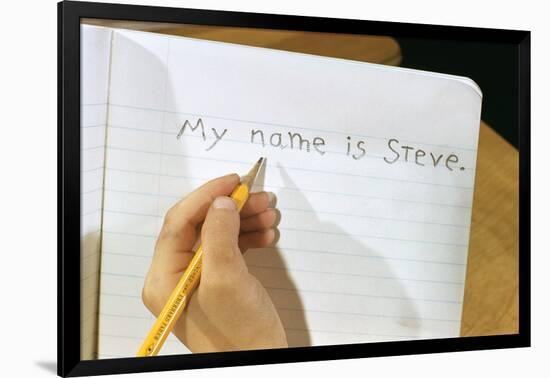 Schoolboy Writing Name in Notebook-William P. Gottlieb-Framed Photographic Print