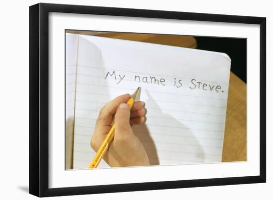 Schoolboy Writing Name in Notebook-William P. Gottlieb-Framed Photographic Print
