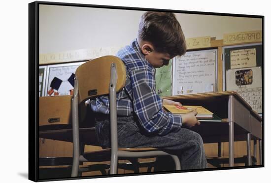 Schoolchild Placing Books in Desk-William P. Gottlieb-Framed Stretched Canvas