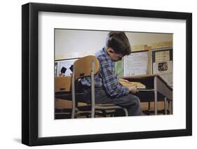 Schoolchild Placing Books in Desk-William P. Gottlieb-Framed Photographic Print