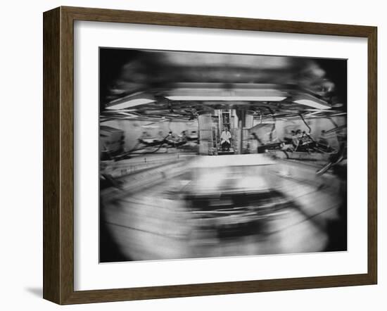 Scientist Jiro Oyama Observing Whirling Cages of Centrifuge Containing Animals-Ralph Crane-Framed Photographic Print