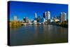 Scioto River and Columbus Ohio skyline in autumn, with setting sunlight-null-Stretched Canvas