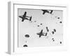 Scores of Paratroopers Dropping from C-82 "Flying Boxcar" and Landing on Level Ground-Frank Scherschel-Framed Photographic Print