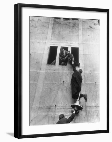 Scottish Fans Scaling Wall to Avoid High Ticket Prices For Soccer Game Between Scotland and England-Cornell Capa-Framed Photographic Print