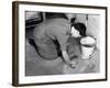 Scrubbing Kitchen Floor-null-Framed Photographic Print