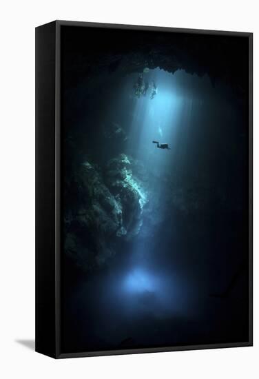 Scuba Diver Descends into the Pit Cenote in Mexico-null-Framed Stretched Canvas