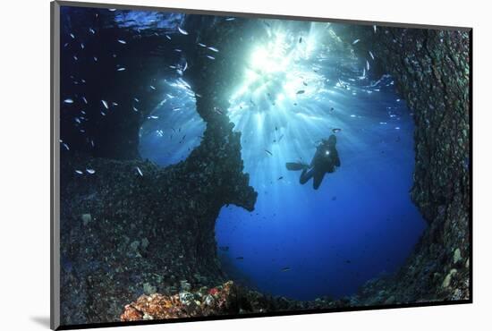 Scuba Diver Swimming through an Arch-Bernard Radvaner-Mounted Photographic Print