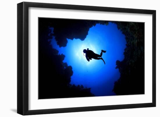 Scuba Diver Swims over Underwater Cave, Silhouette against Sun-Rich Carey-Framed Photographic Print