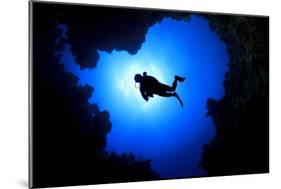 Scuba Diver Swims over Underwater Cave, Silhouette against Sun-Rich Carey-Mounted Photographic Print