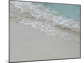 Sea, beach and sand, gentle waves picking up sand particles, Galapagos Islands-Jean Hosking-Mounted Photographic Print