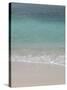 Sea, beach and sand, gentle waves picking up sand particles, Galapagos Islands-Jean Hosking-Stretched Canvas